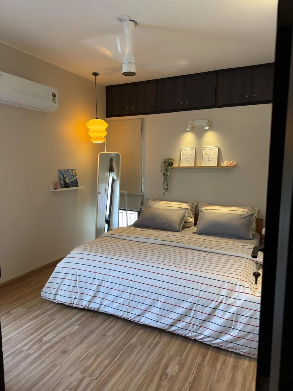 Bedroom one with striped linen